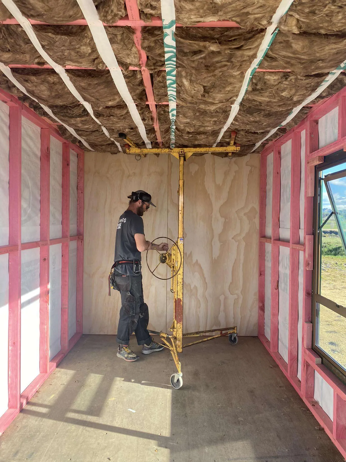 Shipping container interior framed and insulated ready for lining