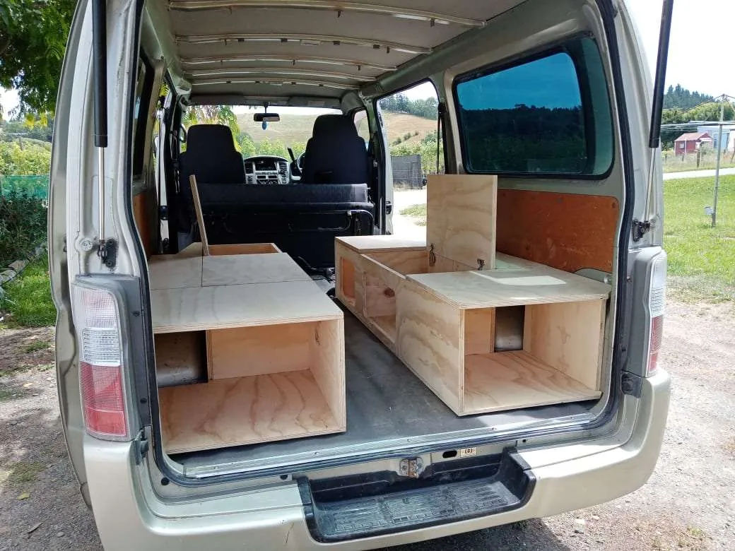 Plywood campervan cabinetry fitted into the back of a van